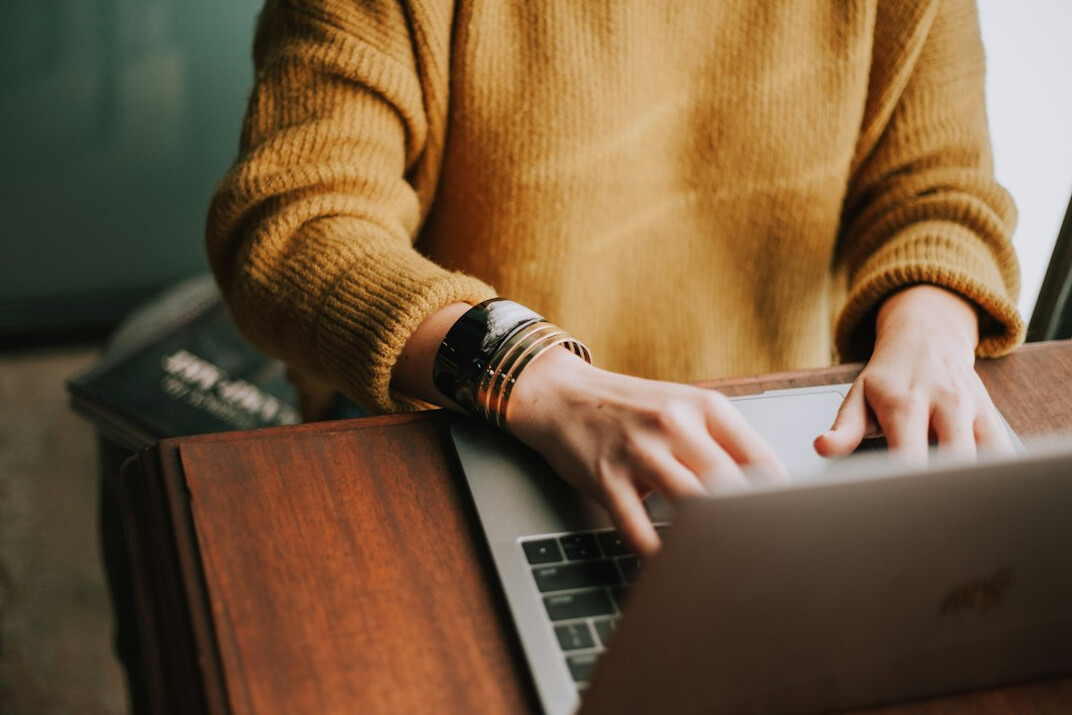person using laptop for software selection