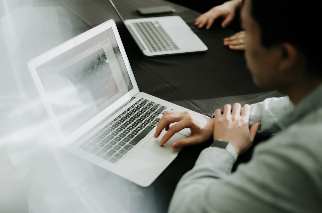 person using laptop for software selection